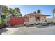 Charming home exterior with a privacy fence, garden and updated landscaping at 1444 Ridgewood Ln, Sarasota, FL 34231