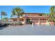 Beautiful two-story home with a well-manicured front yard and charming architectural details at 1444 Ridgewood Ln, Sarasota, FL 34231