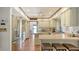 Bright kitchen with stainless steel appliances and breakfast bar seating at 1444 Ridgewood Ln, Sarasota, FL 34231
