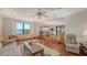 Open-concept living area with views of the waterfront, stylish furnishings and great natural light at 1444 Ridgewood Ln, Sarasota, FL 34231