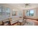 Bright living room with natural light, comfortable seating, and waterfront views, ideal for relaxation at 1444 Ridgewood Ln, Sarasota, FL 34231