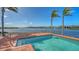 Relax in your own private pool with water views and lush landscaping at 1444 Ridgewood Ln, Sarasota, FL 34231