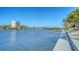 Beautiful waterfront view featuring a seawall, tranquil water, and lush greenery at 1444 Ridgewood Ln, Sarasota, FL 34231