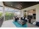 Relaxing balcony area with comfortable seating and a view of the lush tropical landscape at 14819 Bowfin Ter, Lakewood Ranch, FL 34202