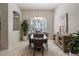 Dining room features neutral paint, a grand window, chandelier, and marble floors at 14819 Bowfin Ter, Lakewood Ranch, FL 34202