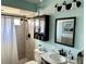 Charming bathroom with a shower and vanity and a medicine cabinet for storage at 1805 Springwood Dr, Sarasota, FL 34232