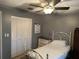 Bedroom features neutral color scheme with ceiling fan, and a closet at 1805 Springwood Dr, Sarasota, FL 34232
