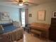 Inviting bedroom featuring large window with tiled floors and comfortable furnishings at 1805 Springwood Dr, Sarasota, FL 34232