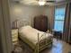 Cozy bedroom with ceiling fan and neutral color scheme, flooded with natural light at 1805 Springwood Dr, Sarasota, FL 34232