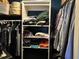 Neatly organized closet with ample storage space for clothing and accessories at 1805 Springwood Dr, Sarasota, FL 34232