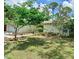 A beautifully landscaped yard surrounds this bright and inviting single-Gathering home at 1805 Springwood Dr, Sarasota, FL 34232