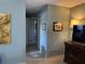 Hallway with tile floors, neutral paint and plenty of closet storage at 1805 Springwood Dr, Sarasota, FL 34232