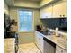 Well-equipped kitchen with stainless steel appliances, ample counter space, and a bright window at 1805 Springwood Dr, Sarasota, FL 34232