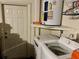 Laundry area featuring a modern washing machine and water heater, providing convenience and functionality at 1805 Springwood Dr, Sarasota, FL 34232