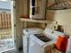 Convenient laundry room with washer, dryer, and easy access to the outside at 1805 Springwood Dr, Sarasota, FL 34232