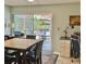 Bright office space with desk, computer and sliding glass door leading to screened outdoor space at 1805 Springwood Dr, Sarasota, FL 34232