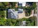 An aerial top-down shot showing the home's layout and beautiful landscaping and exterior features at 1909 Field Rd, Sarasota, FL 34231
