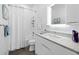Clean bathroom featuring a walk in shower, toilet and quartz vanity with backsplash at 1909 Field Rd, Sarasota, FL 34231