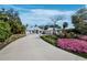Beautiful landscaping adds to the curb appeal of this home with an extra large driveway at 1909 Field Rd, Sarasota, FL 34231