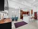 Eat-in kitchen area features modern cabinetry, a marble countertop and island, and sleek barstool seating at 1909 Field Rd, Sarasota, FL 34231