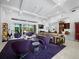 Open-concept living area flows into the dining and kitchen, perfect for entertaining at 1909 Field Rd, Sarasota, FL 34231