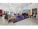 Expansive living room boasts high ceilings, modern decor, and seamless access to outdoor spaces at 1909 Field Rd, Sarasota, FL 34231