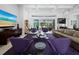 Bright living room offering stylish seating, modern decor, and access to a screened lanai at 1909 Field Rd, Sarasota, FL 34231