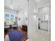 Bright office space with hardwood floors, comfortable seating, and access to a bathroom at 1909 Field Rd, Sarasota, FL 34231
