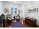 Cozy office space featuring hardwood floors, comfortable seating, and natural light at 1909 Field Rd, Sarasota, FL 34231