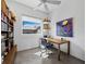 Comfortable home office featuring a modern desk, shelving and bright light from the window at 1909 Field Rd, Sarasota, FL 34231