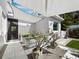 Outdoor patio featuring shade sails, planters, and a modern design creating a welcoming atmosphere at 1909 Field Rd, Sarasota, FL 34231