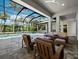 Outdoor space offers a screened pool and ample seating at 1909 Field Rd, Sarasota, FL 34231