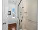Bright shower space with frameless glass doors and refined hardware at 1909 Field Rd, Sarasota, FL 34231