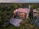Aerial view of the property with a screened lanai and backyard pool area at 1930 Bayshore Dr, Englewood, FL 34223
