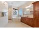 Elegant bathroom featuring a soaking tub, walk-in shower, and custom vanity with ample storage at 1930 Bayshore Dr, Englewood, FL 34223
