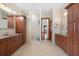 Modern bathroom with dual vanities, wood cabinets, and decorative accents at 1930 Bayshore Dr, Englewood, FL 34223