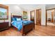 Bedroom with hardwood floors, natural light, and two closets at 1930 Bayshore Dr, Englewood, FL 34223