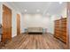 Cozy bonus room with neutral sofa, wood flooring and vintage dresser at 1930 Bayshore Dr, Englewood, FL 34223