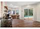 Bright kitchen space offering granite countertops, wood floors, and a scenic outdoor view of the pool at 1930 Bayshore Dr, Englewood, FL 34223
