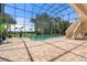 Indoor pool area with a beautiful pool and a relaxing view at 1930 Bayshore Dr, Englewood, FL 34223