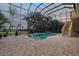 Enclosed pool and patio area with a great view of the outdoors at 1930 Bayshore Dr, Englewood, FL 34223