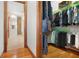 Organized walk-in closet with hanging racks and shelves for clothing and accessories at 1930 Bayshore Dr, Englewood, FL 34223
