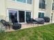 Outdoor patio area with comfortable seating and grilling amenities for relaxation at 225 Country Club Dr # 1104, Largo, FL 33771