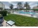 Relaxing pool area surrounded by lush greenery and a fence for added privacy at 225 Country Club Dr # 1104, Largo, FL 33771