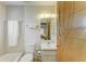 Clean bathroom with a tub-shower combo, a white sink vanity, and modern fixtures at 2402 Scenic Dr, Venice, FL 34293