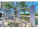 View of the outdoor lanai with screen enclosure offering an outdoor entertainment area at 2402 Scenic Dr, Venice, FL 34293