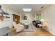 Open living room featuring hardwood floors, skylight, neutral paint, and comfortable seating at 2402 Scenic Dr, Venice, FL 34293