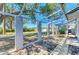 Screened patio with view to the backyard and shade perfect for outdoor enjoyment at 2402 Scenic Dr, Venice, FL 34293