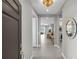 Elegant foyer with tile flooring and views of the open-concept living spaces beyond at 253 Tracino Ter, Nokomis, FL 34275