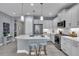 Beautiful kitchen with granite countertops, stainless steel appliances, and bar stool seating at 253 Tracino Ter, Nokomis, FL 34275